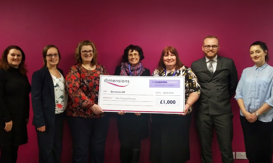 Staff from Central England Co-operative Funeralcare, Dementia UK and Dimensions at the cheque presentation