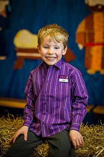 Owen proudly modelling his uniform