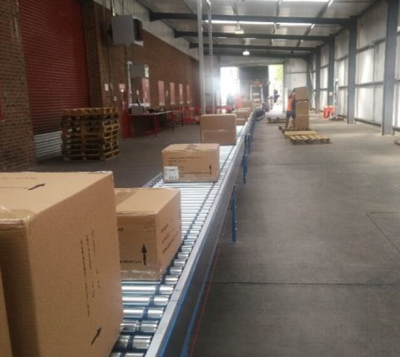 Logistics Centre Makes Investment In Flat-Bed Conveyor